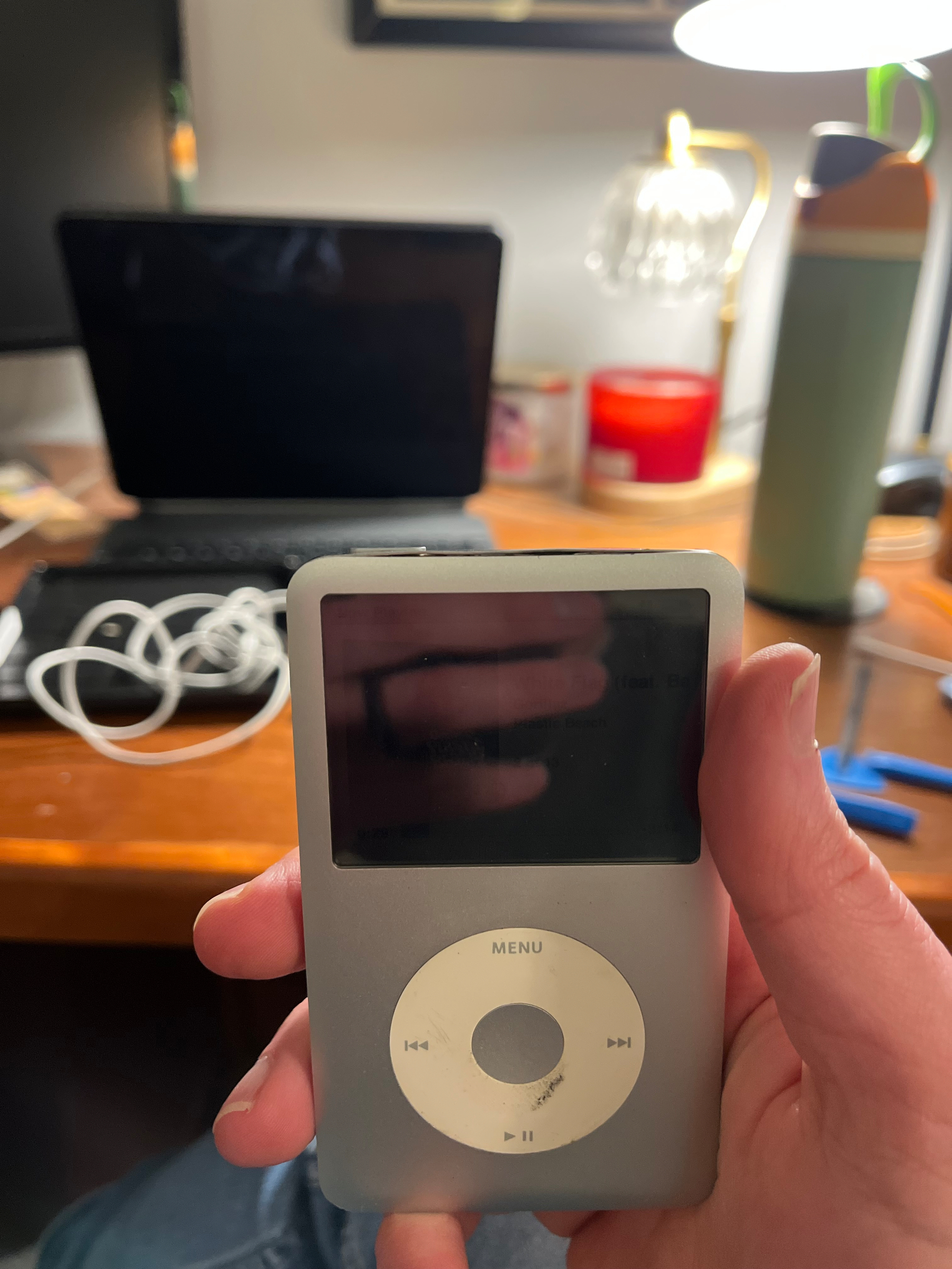 An iPod with minor case damage on the top